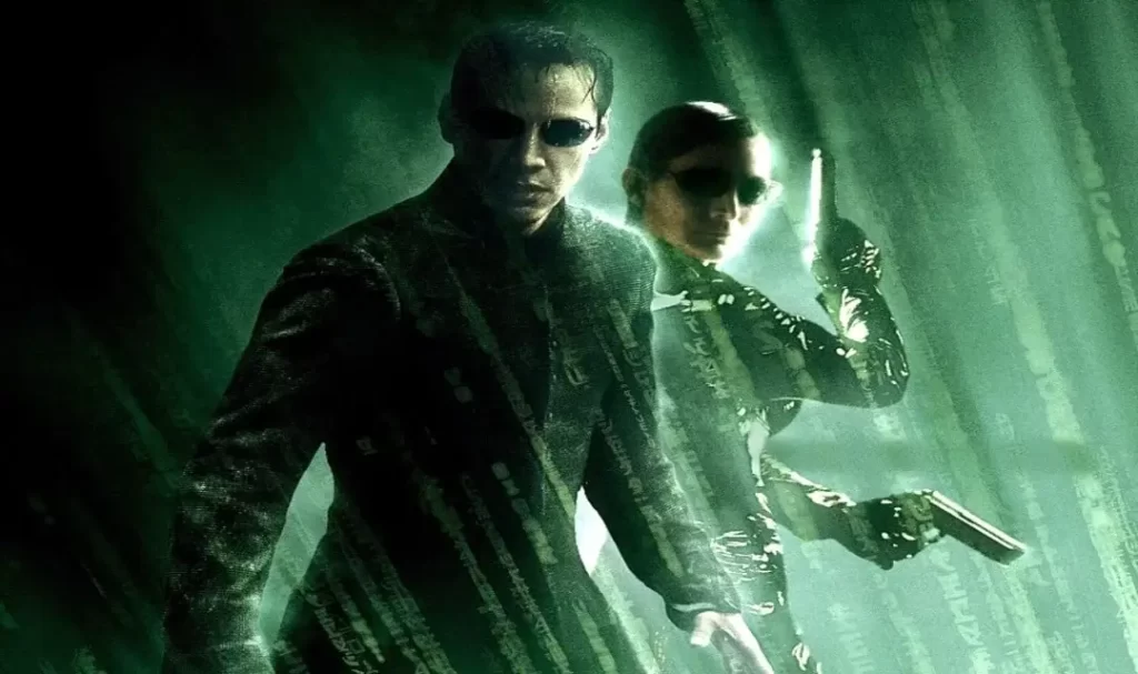 Neo e Trinity aparecem em pose de luta em meio a chuva em Matrix Revolutions. Post 6 Filmes com Finais Decepcionantes.